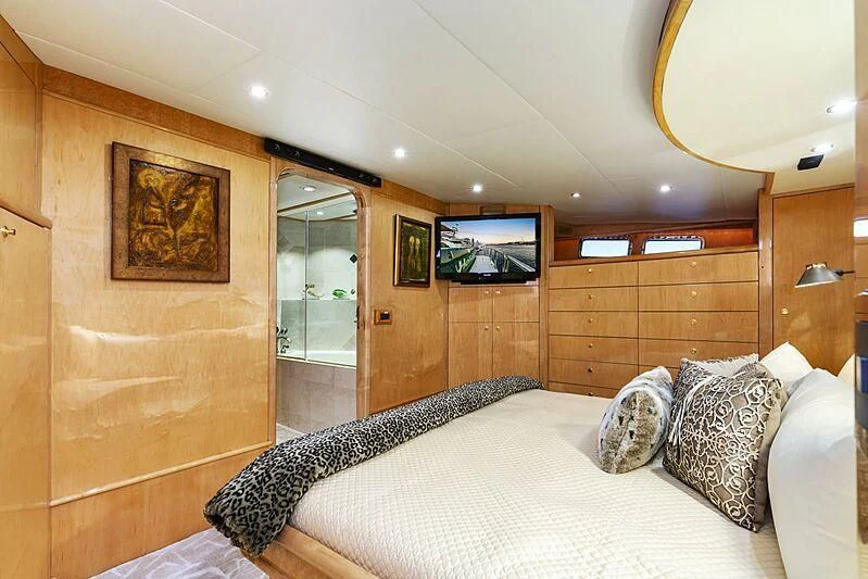 a bedroom with a large bed aboard HOLIDAY Yacht for Sale