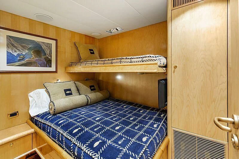 a bed in a room aboard HOLIDAY Yacht for Sale
