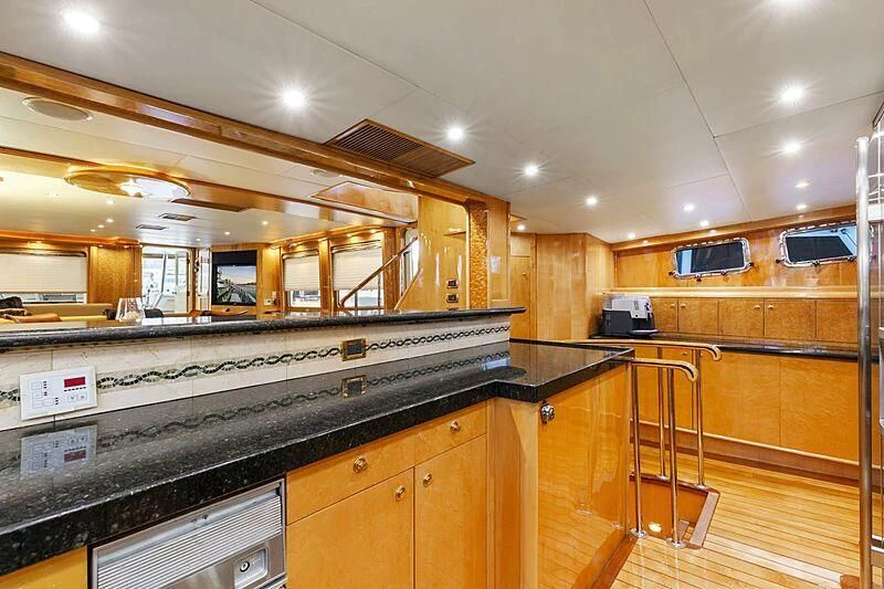 a kitchen with a large island aboard HOLIDAY Yacht for Sale