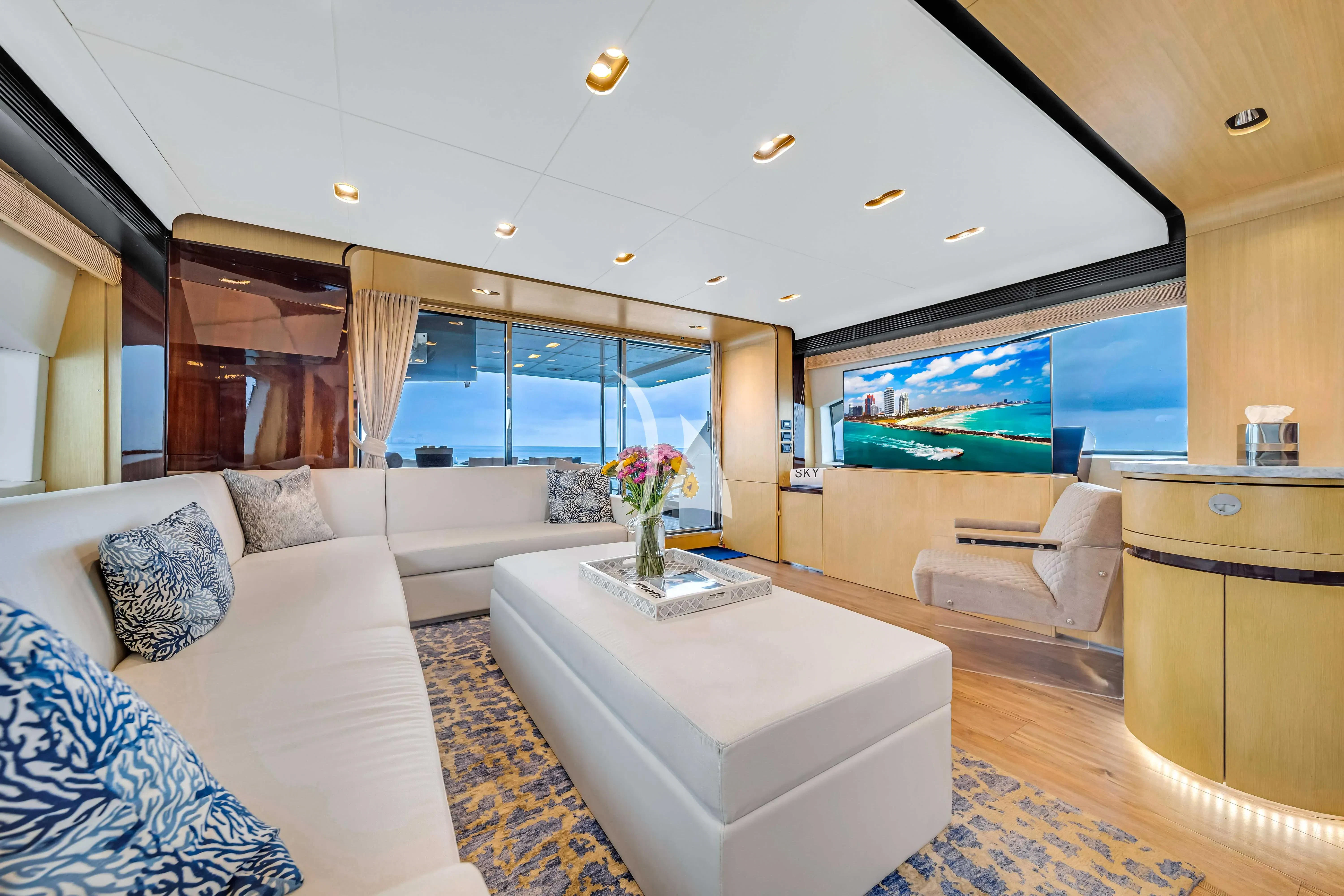 a living room with a large window aboard SKY Yacht for Sale