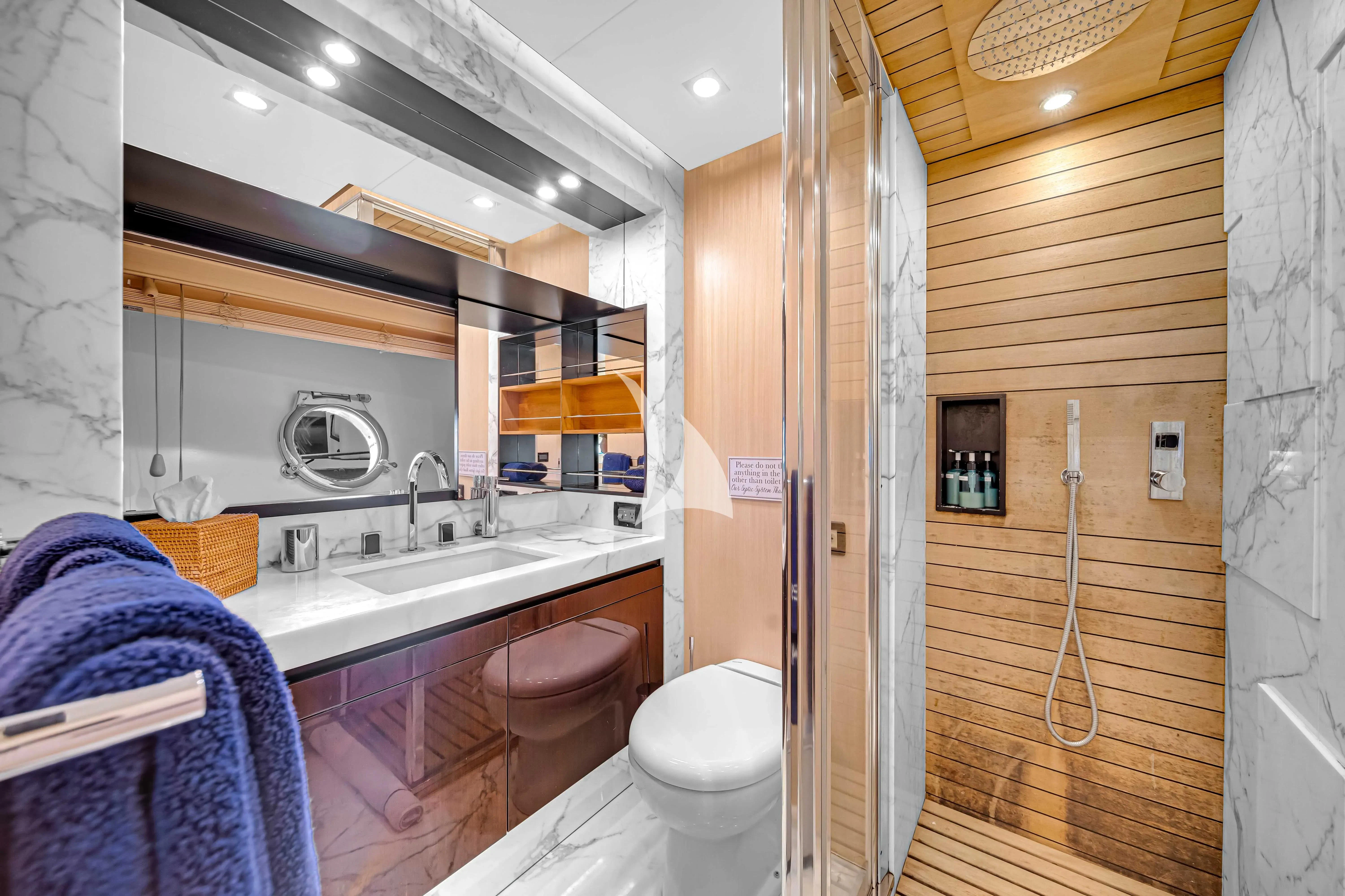 a bathroom with a sink and a toilet aboard SKY Yacht for Sale