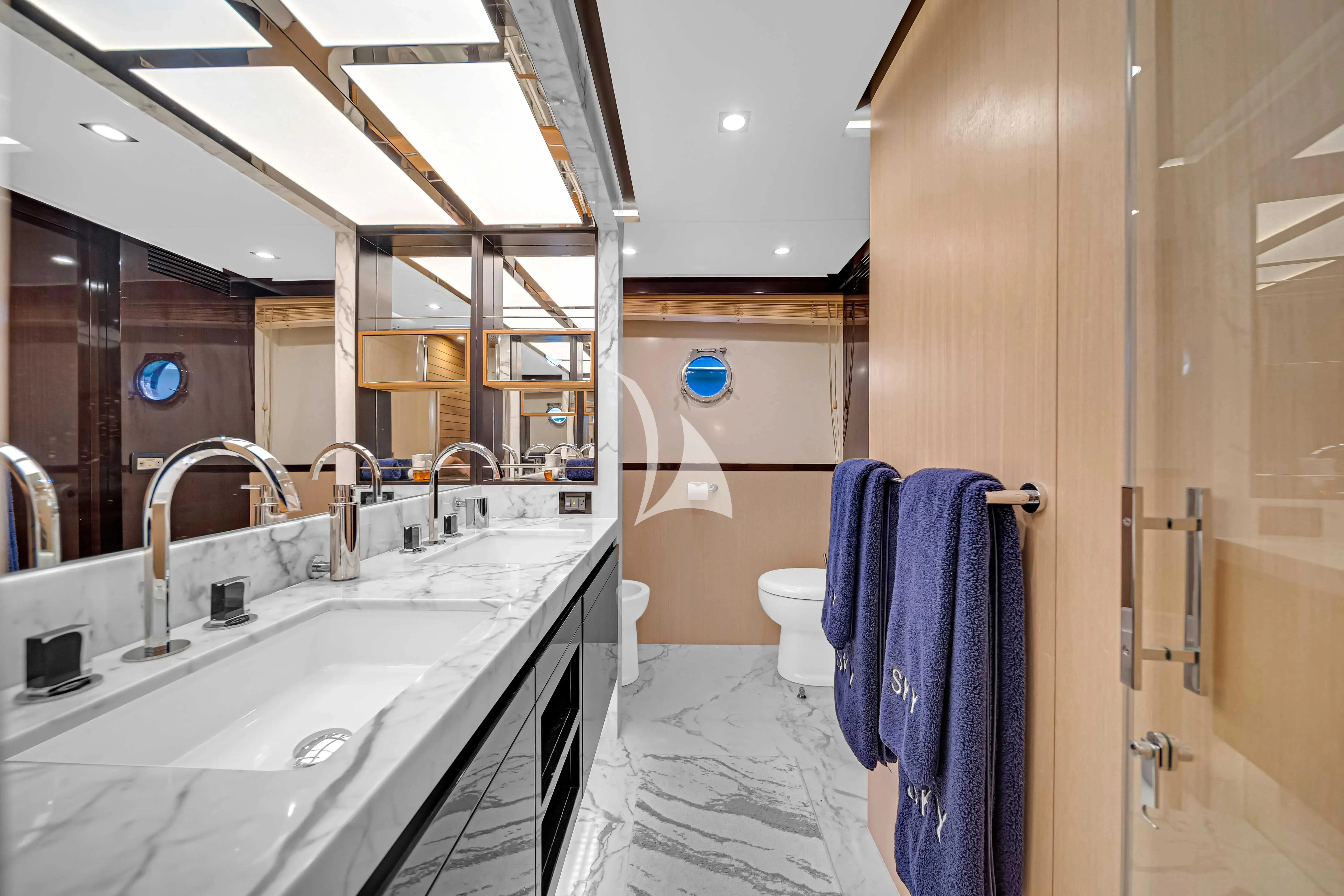 a bathroom with a sink and a mirror aboard SKY Yacht for Sale