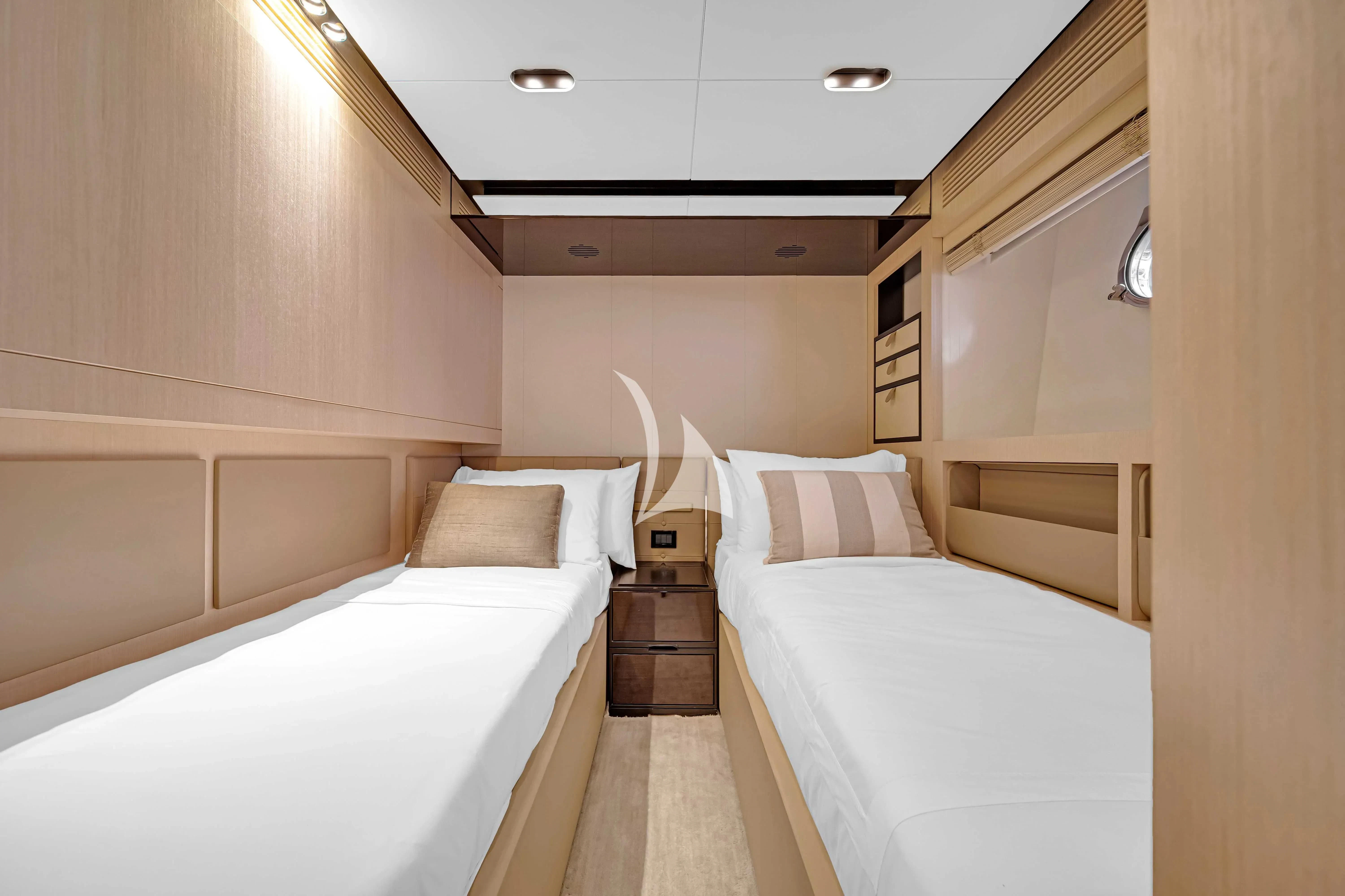 a room with a couple of beds aboard SKY Yacht for Sale