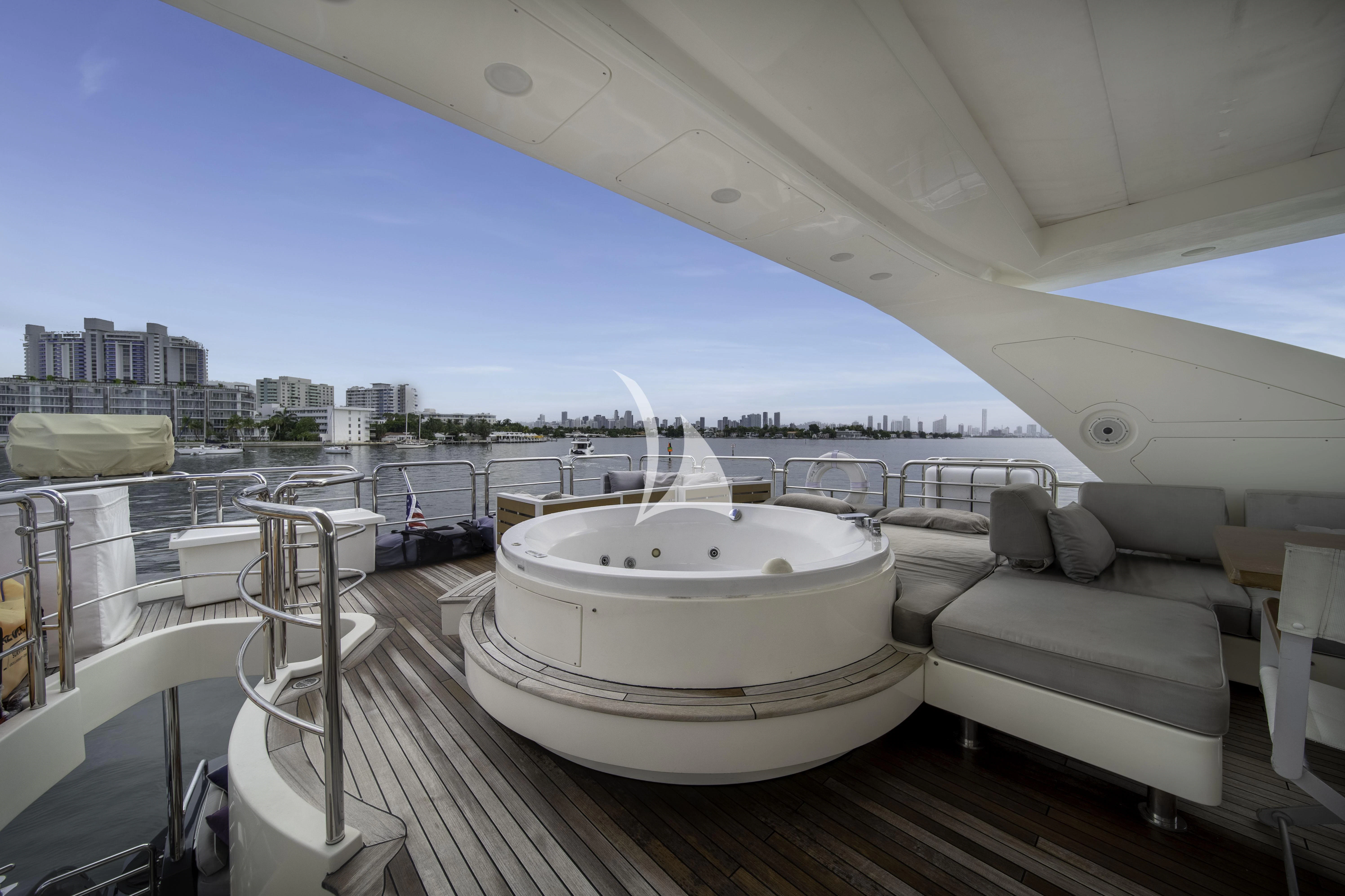 a large white boat on a deck aboard SKY Yacht for Sale