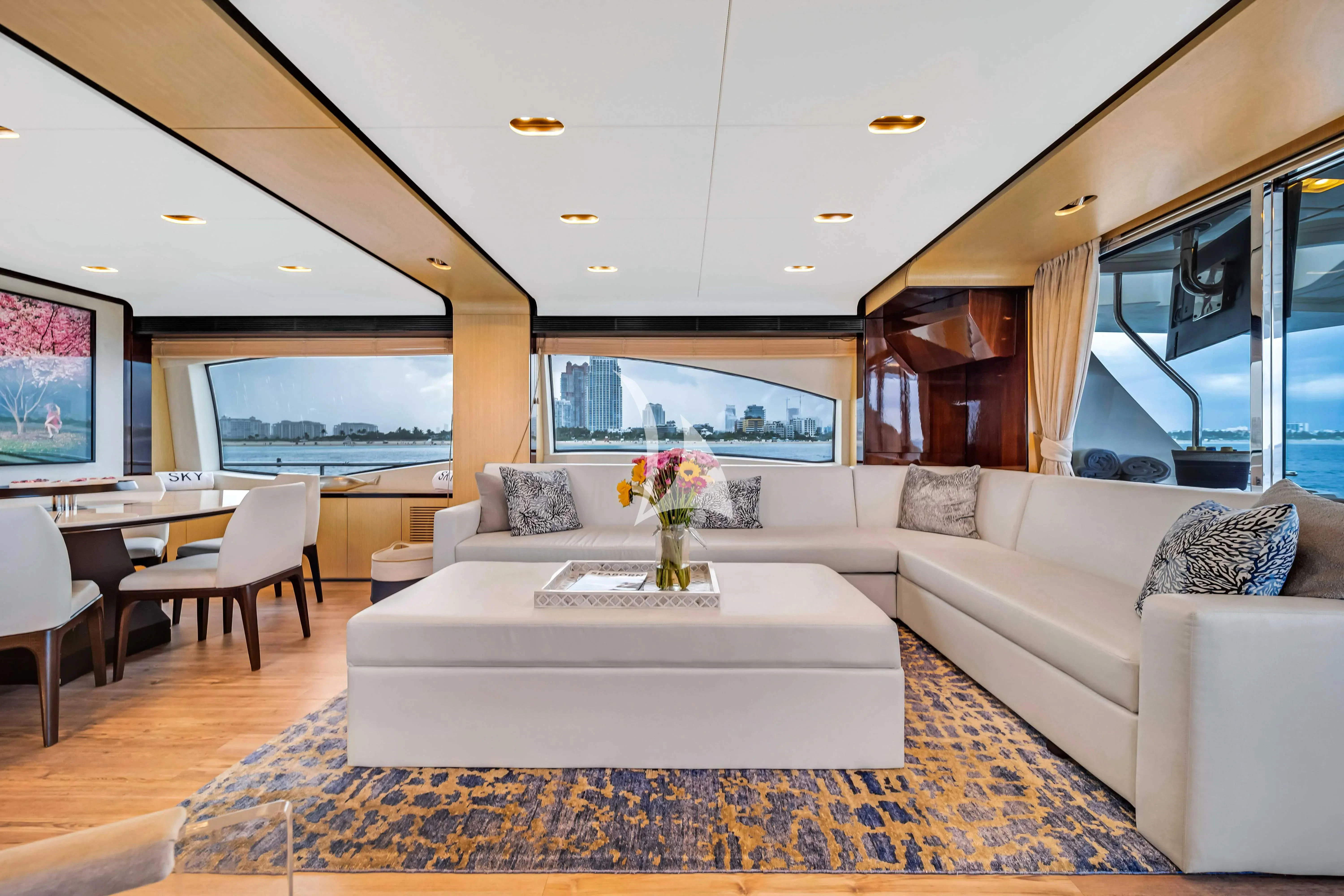 a living room with a large window aboard SKY Yacht for Sale