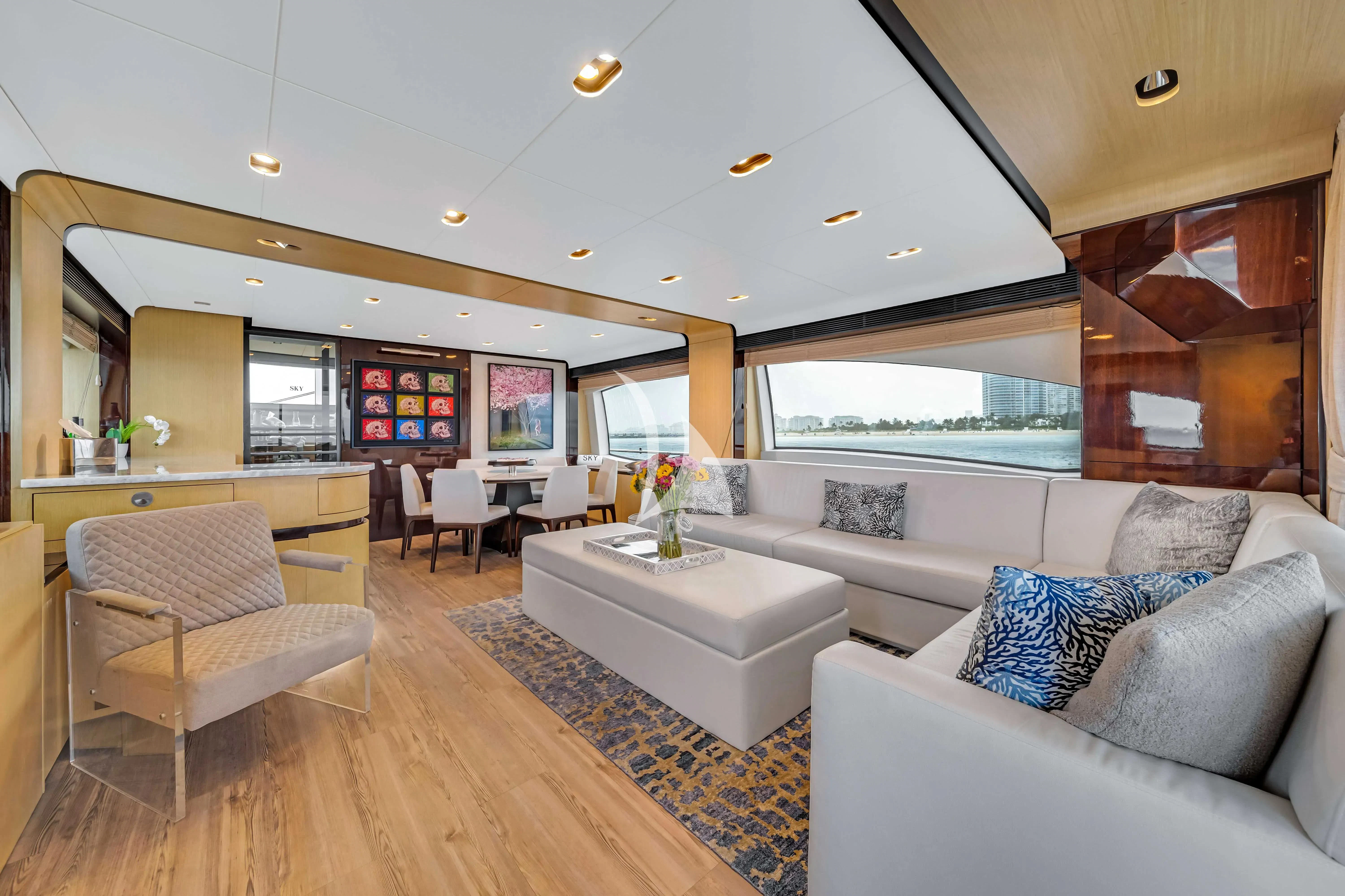 a living room with a couch and a table aboard SKY Yacht for Sale