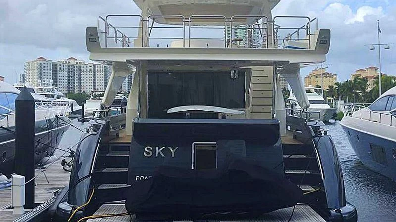 a black truck on a dock aboard SKY Yacht for Sale
