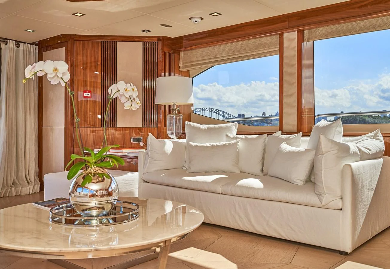 a living room with a large window aboard CHAOS Yacht for Sale