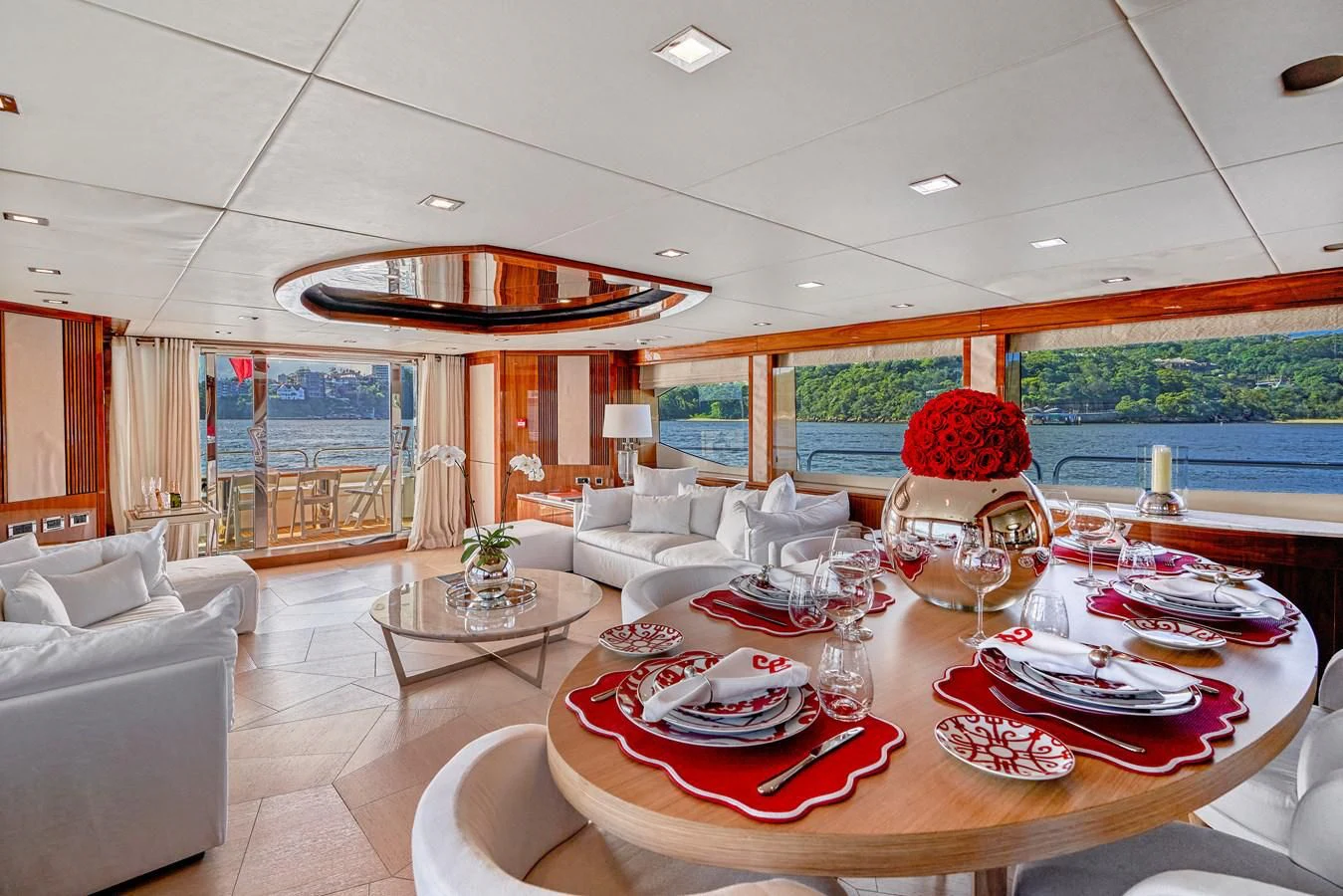 a large living room with a large swimming pool aboard CHAOS Yacht for Sale