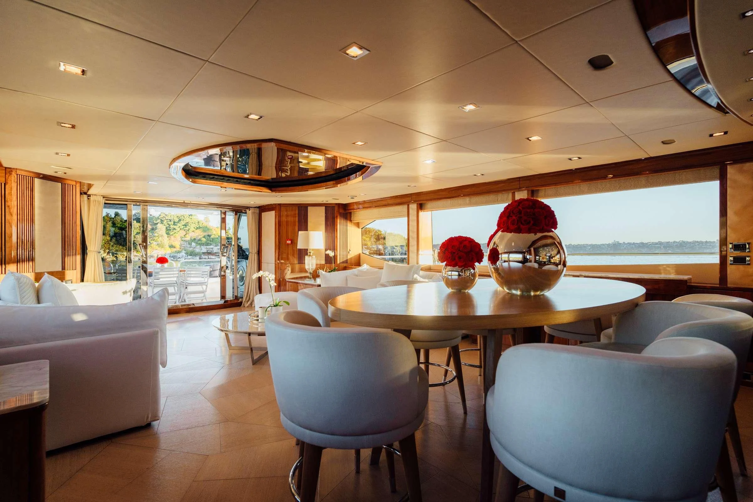 a room with a table and chairs aboard CHAOS Yacht for Sale