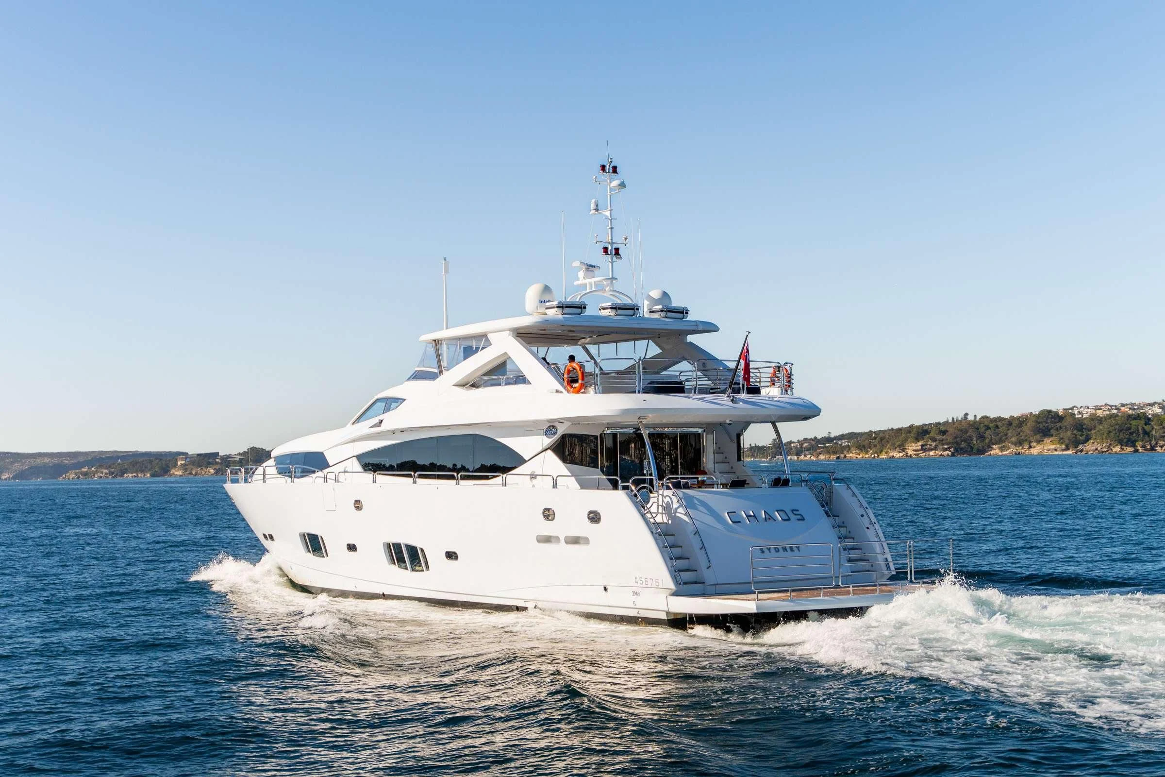 a white boat on water aboard CHAOS Yacht for Sale
