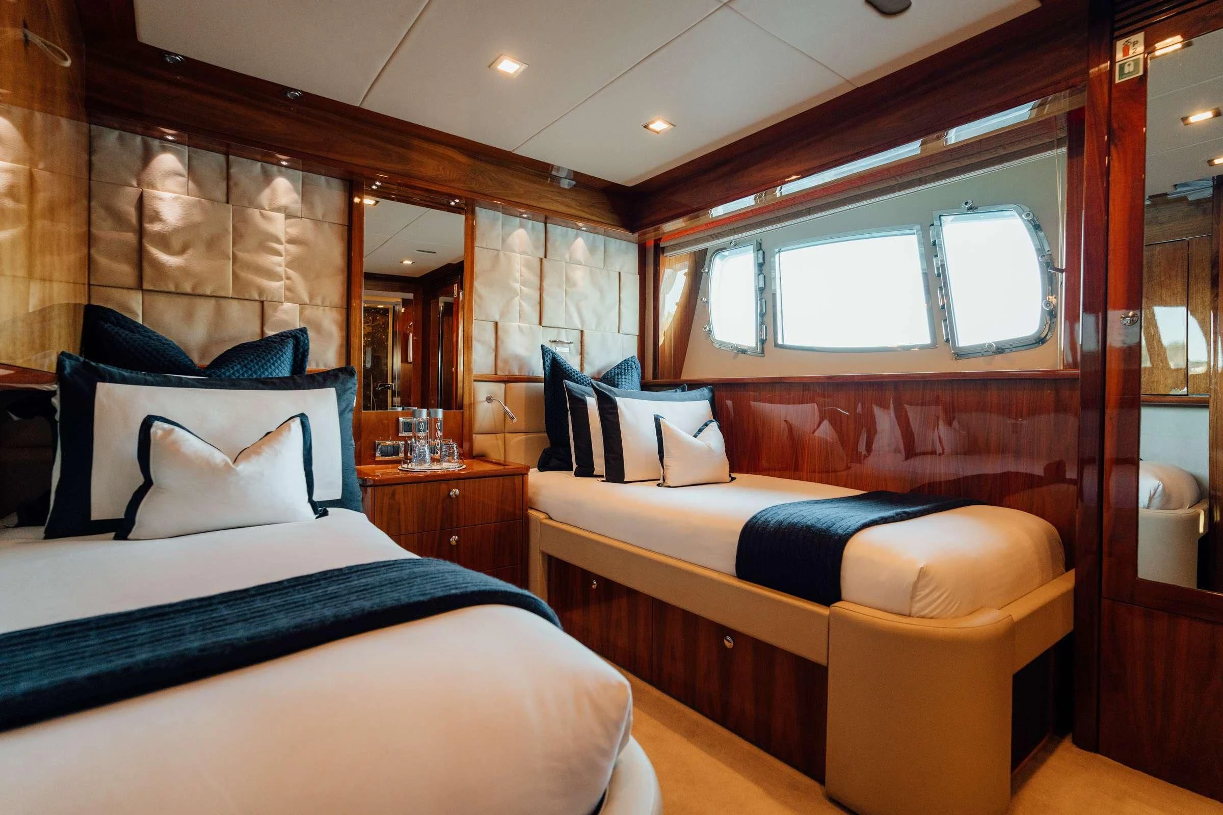 a room with a bed and a couch aboard CHAOS Yacht for Sale