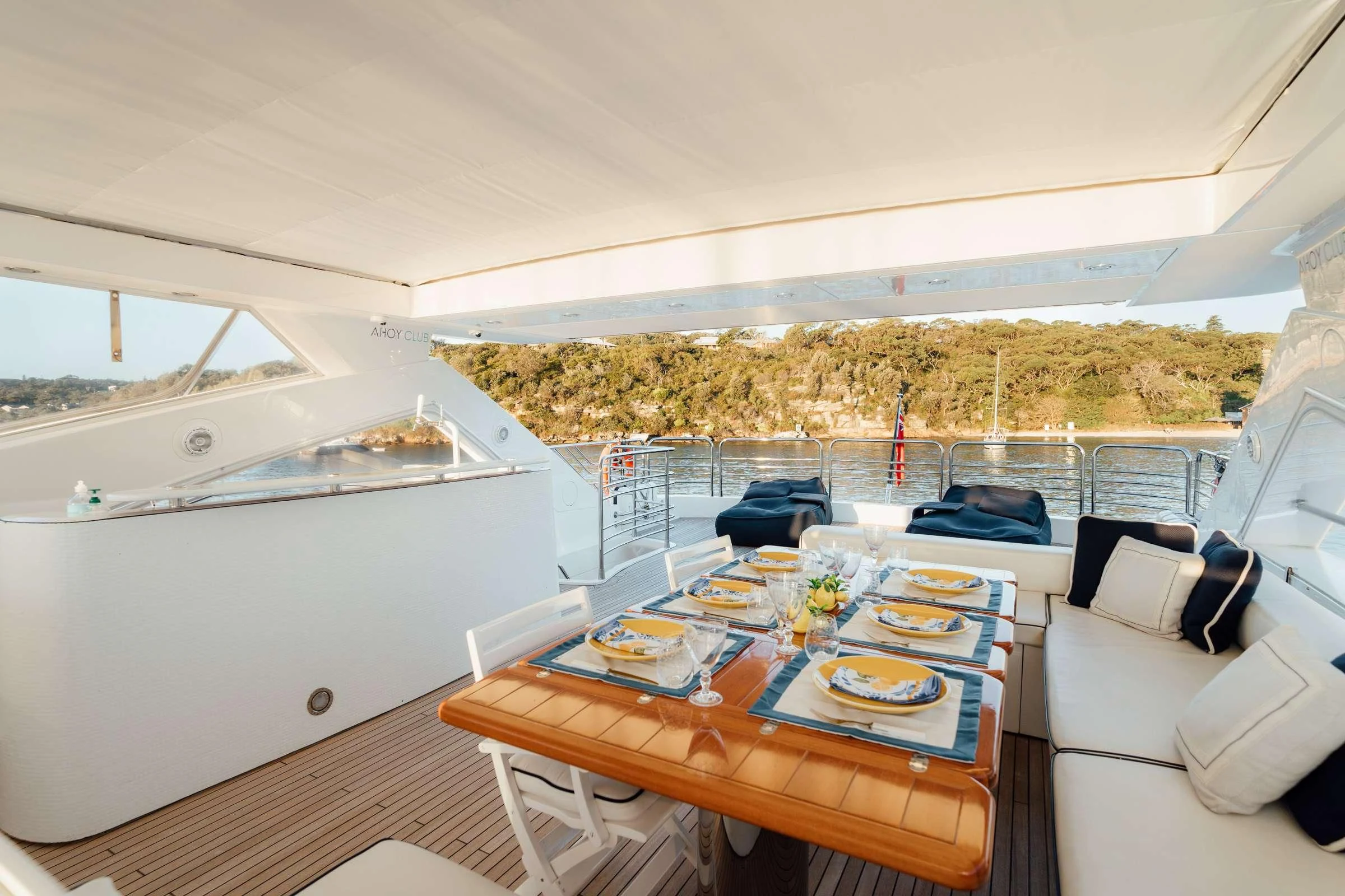 a table with plates and food on it aboard CHAOS Yacht for Sale