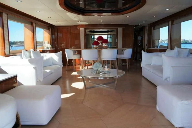 a living room with a table and chairs aboard CHAOS Yacht for Sale