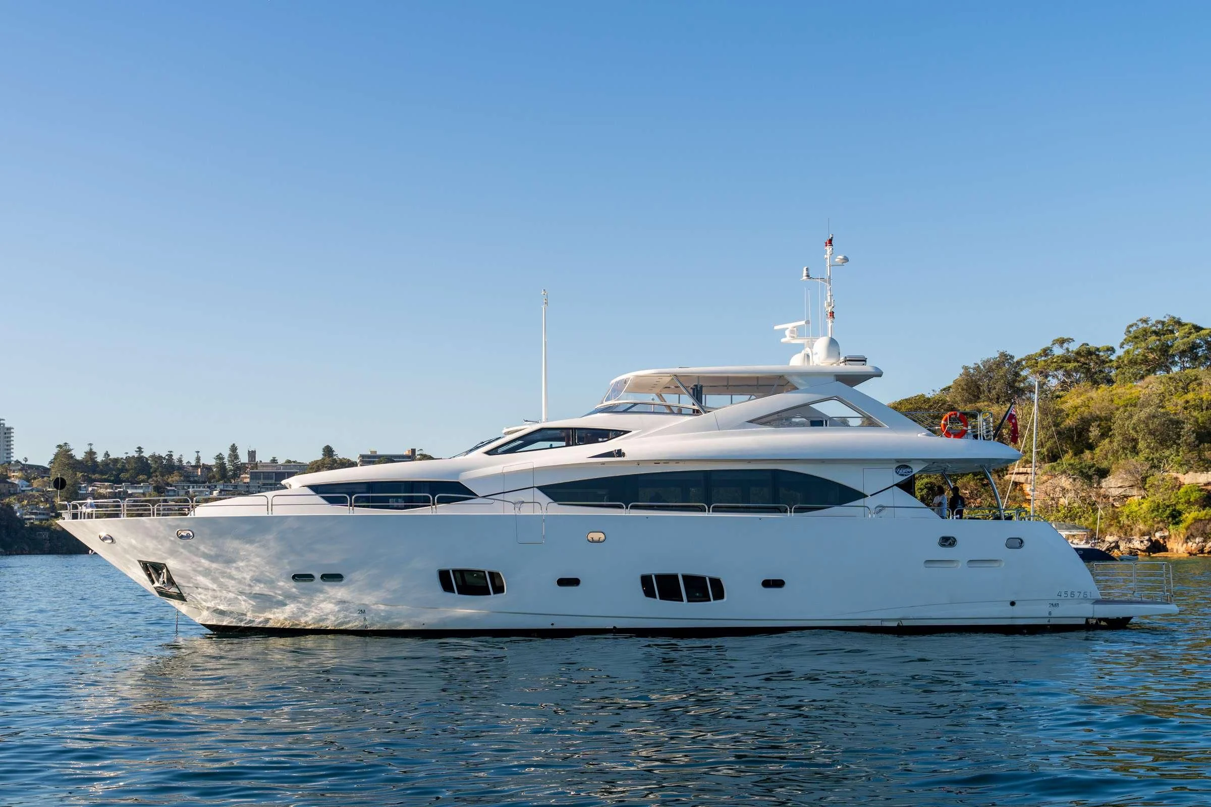 a white yacht on the water aboard CHAOS Yacht for Sale