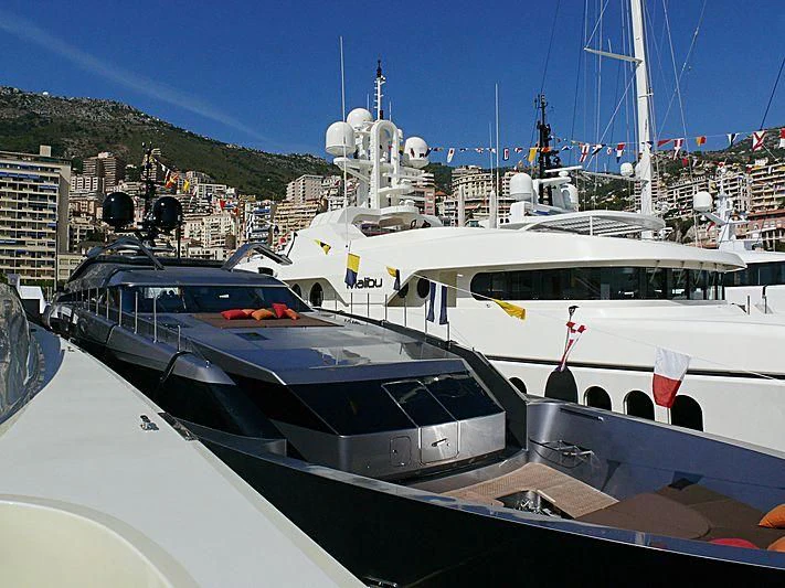 a couple of boats are parked in a harbor aboard 4A Yacht for Sale
