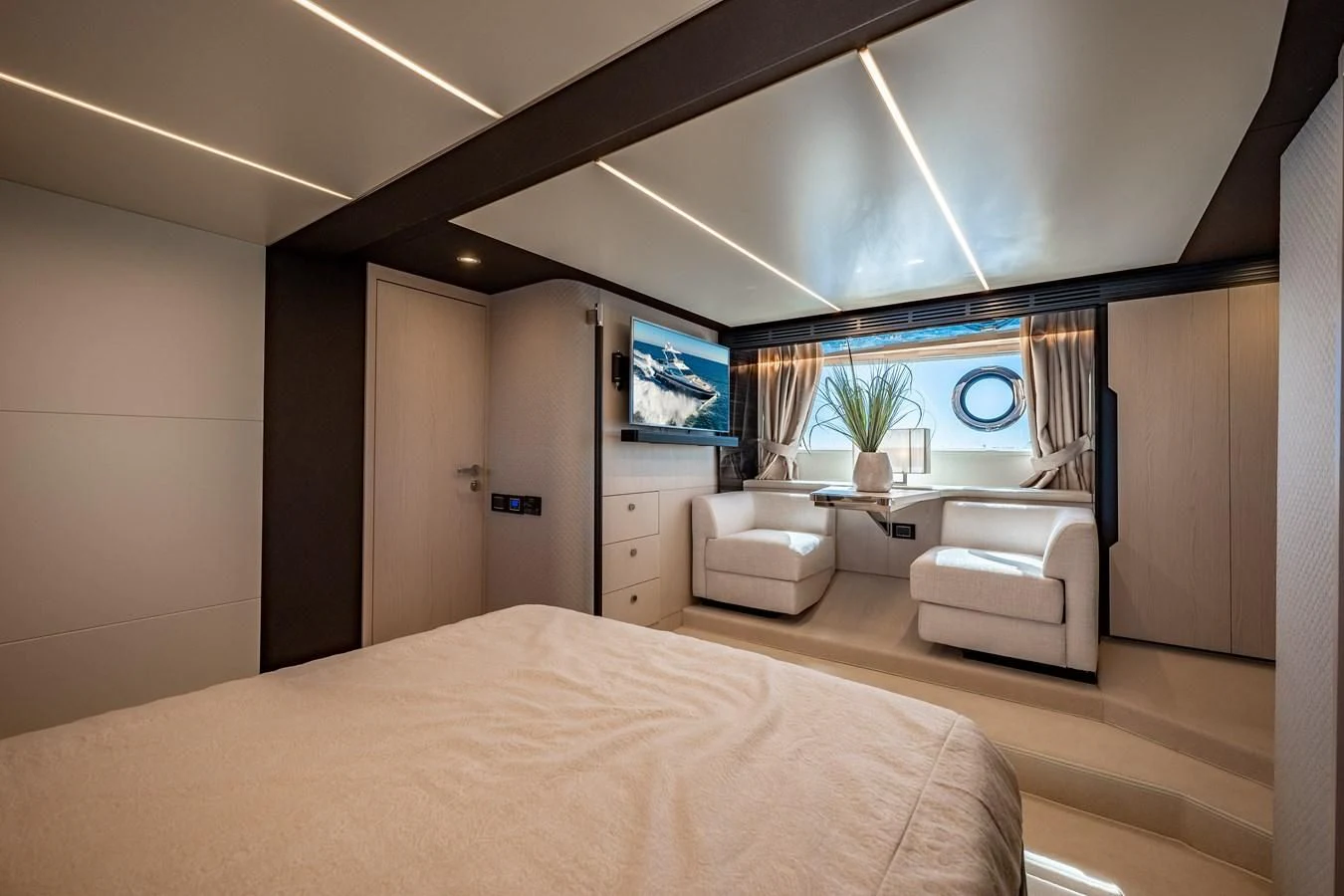 a bedroom with a bed and a tv on the wall aboard KNOT DIVORCE Yacht for Sale