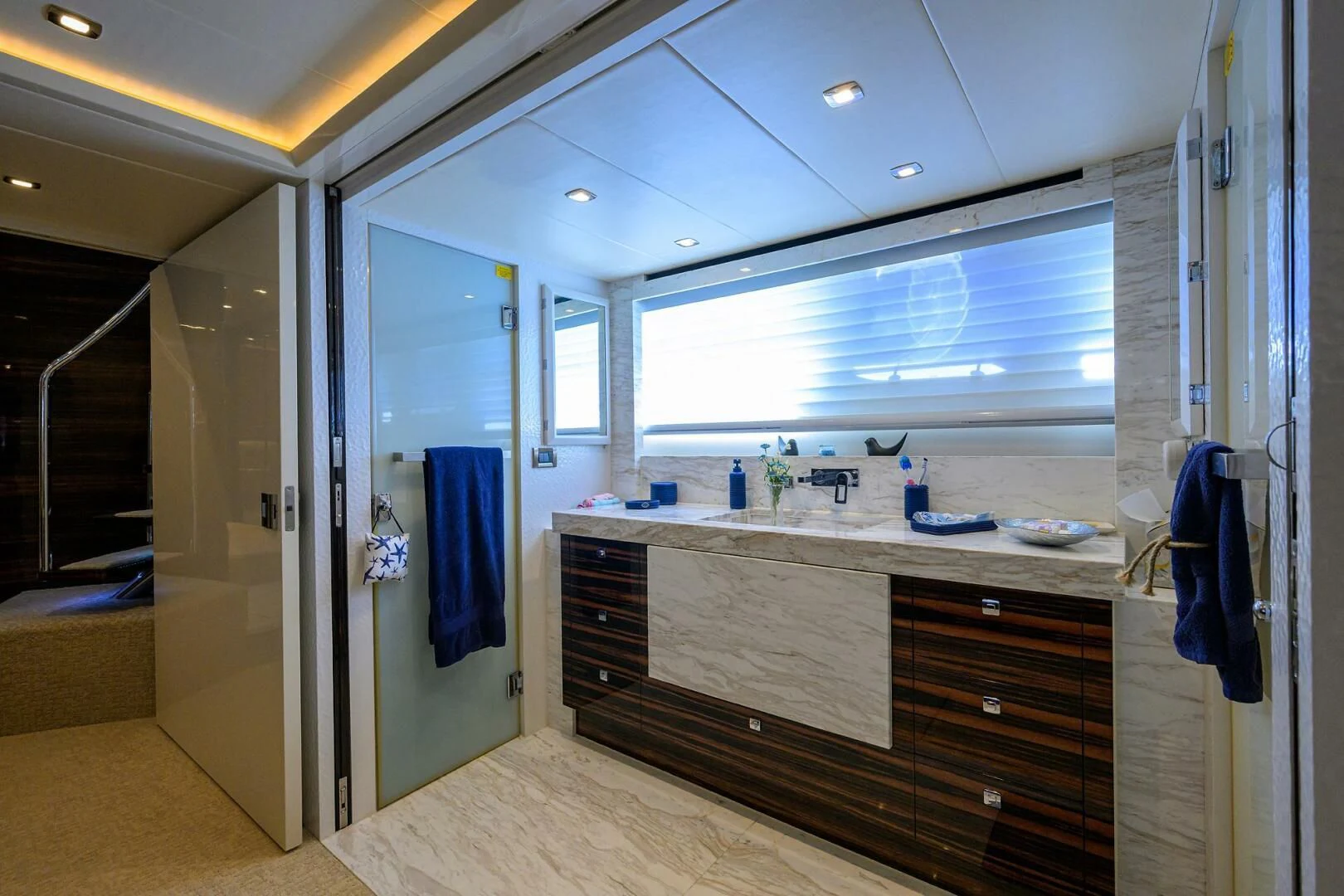 a bathroom with a countertop sink and cabinets aboard FUJIMO Yacht for Sale