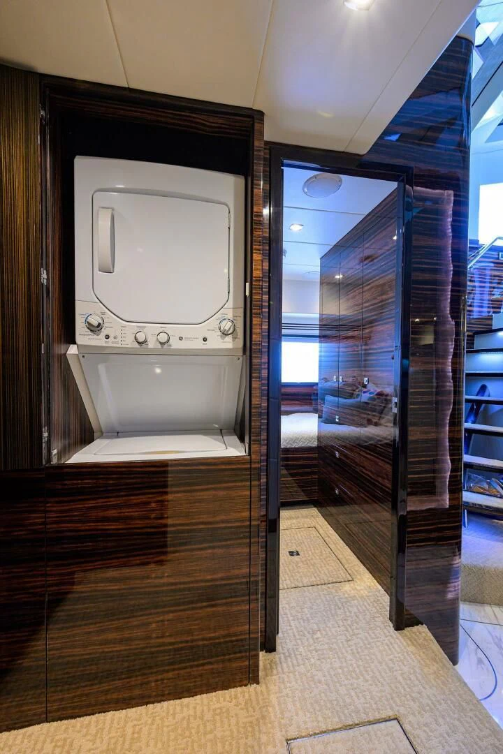 a bathroom with a washer and dryer aboard FUJIMO Yacht for Sale