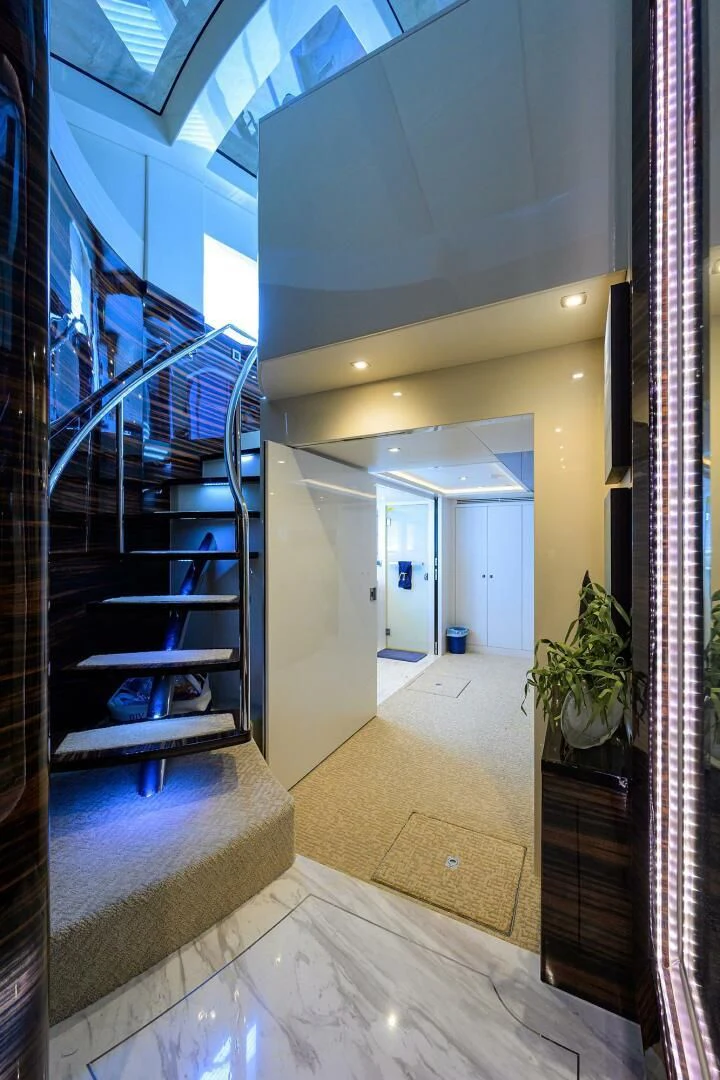 a hallway with a glass door aboard FUJIMO Yacht for Sale