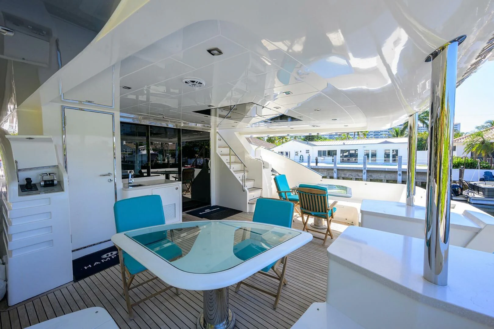 a room with a pool table and chairs aboard FUJIMO Yacht for Sale
