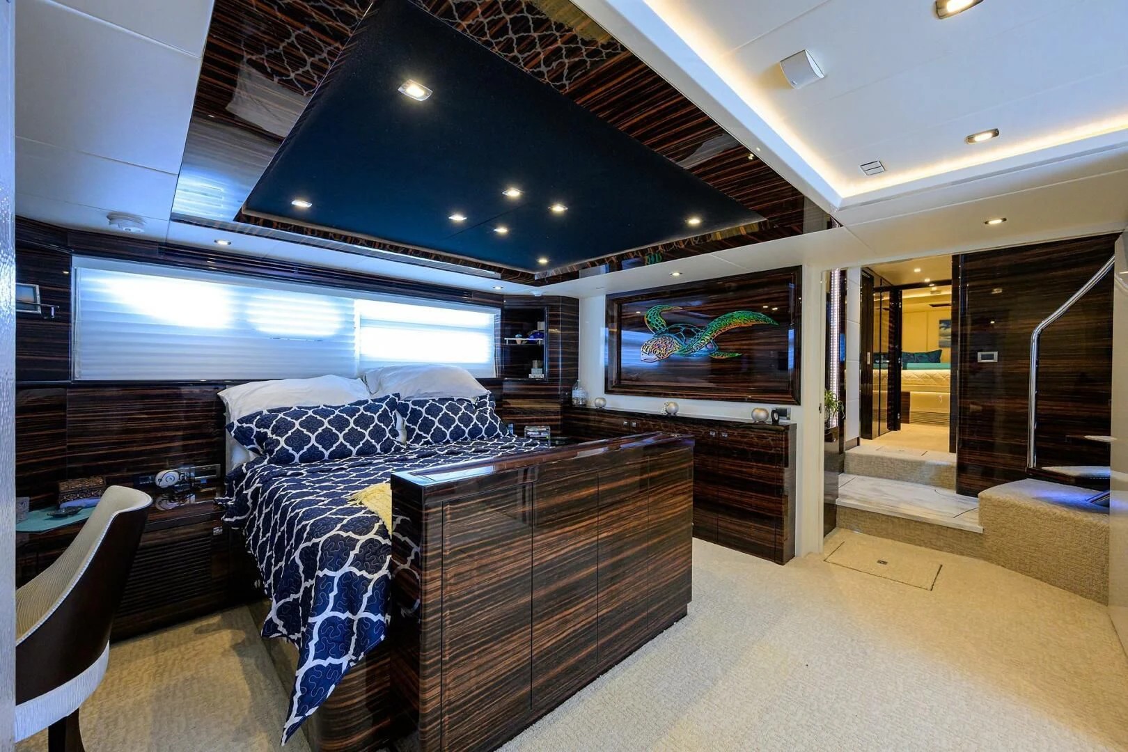 a room with couches and a tv aboard FUJIMO Yacht for Sale