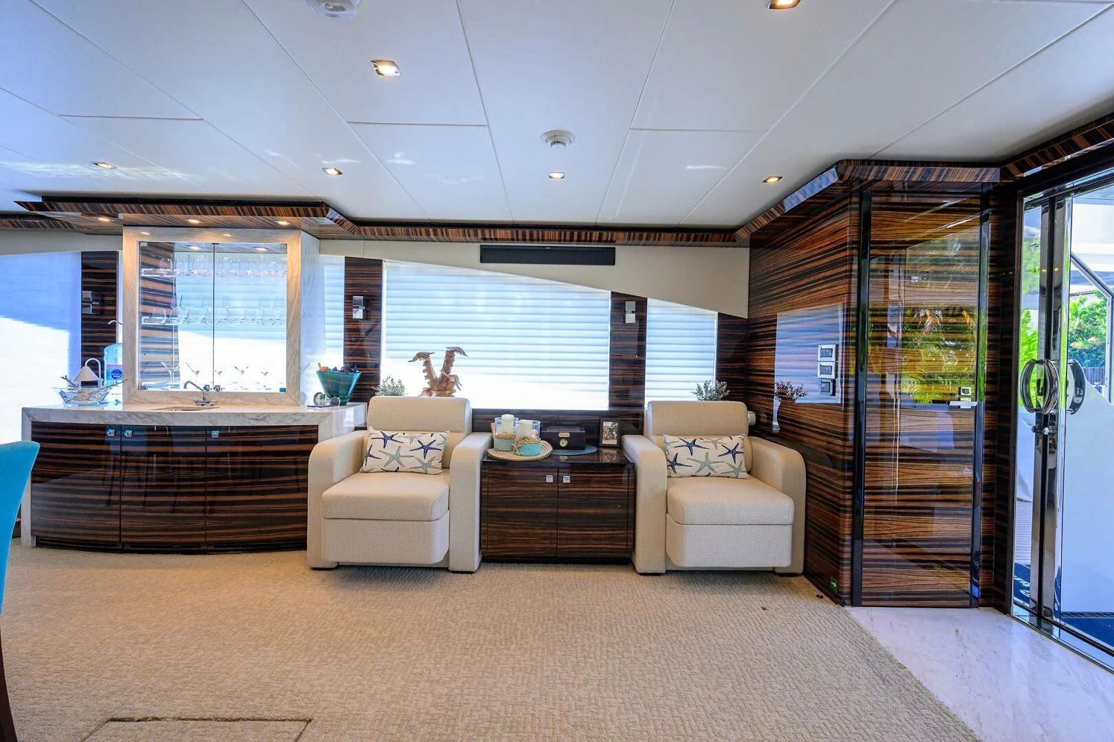 a large room with a couch and a large window aboard FUJIMO Yacht for Sale