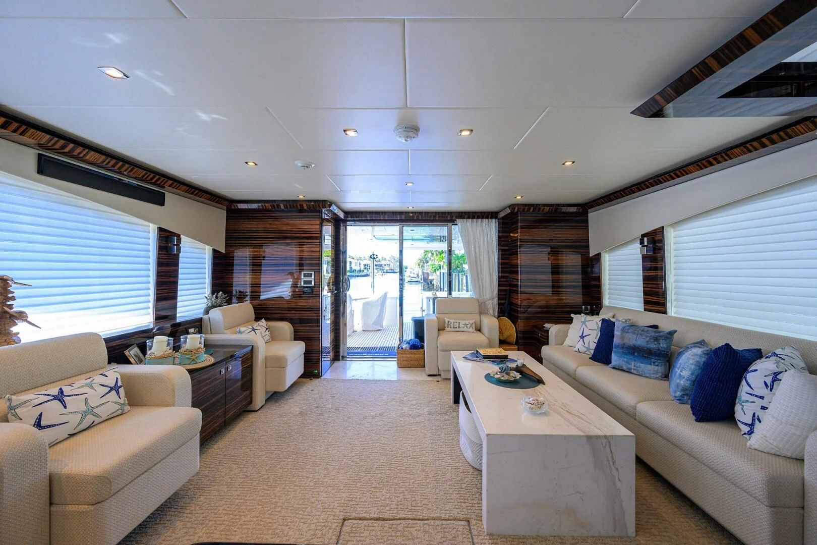 a living room with a large window aboard FUJIMO Yacht for Sale