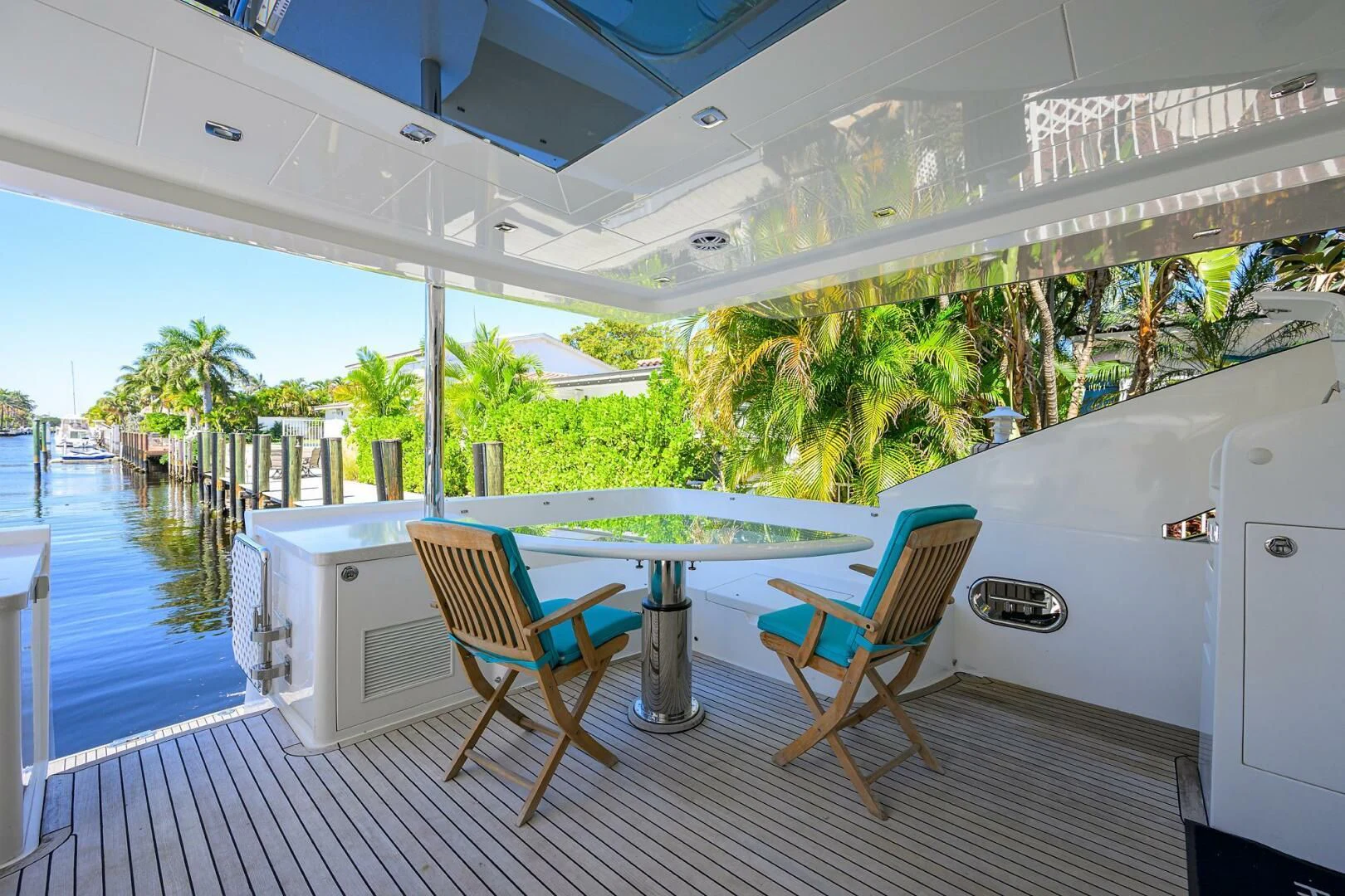 a deck with a pool and chairs aboard FUJIMO Yacht for Sale