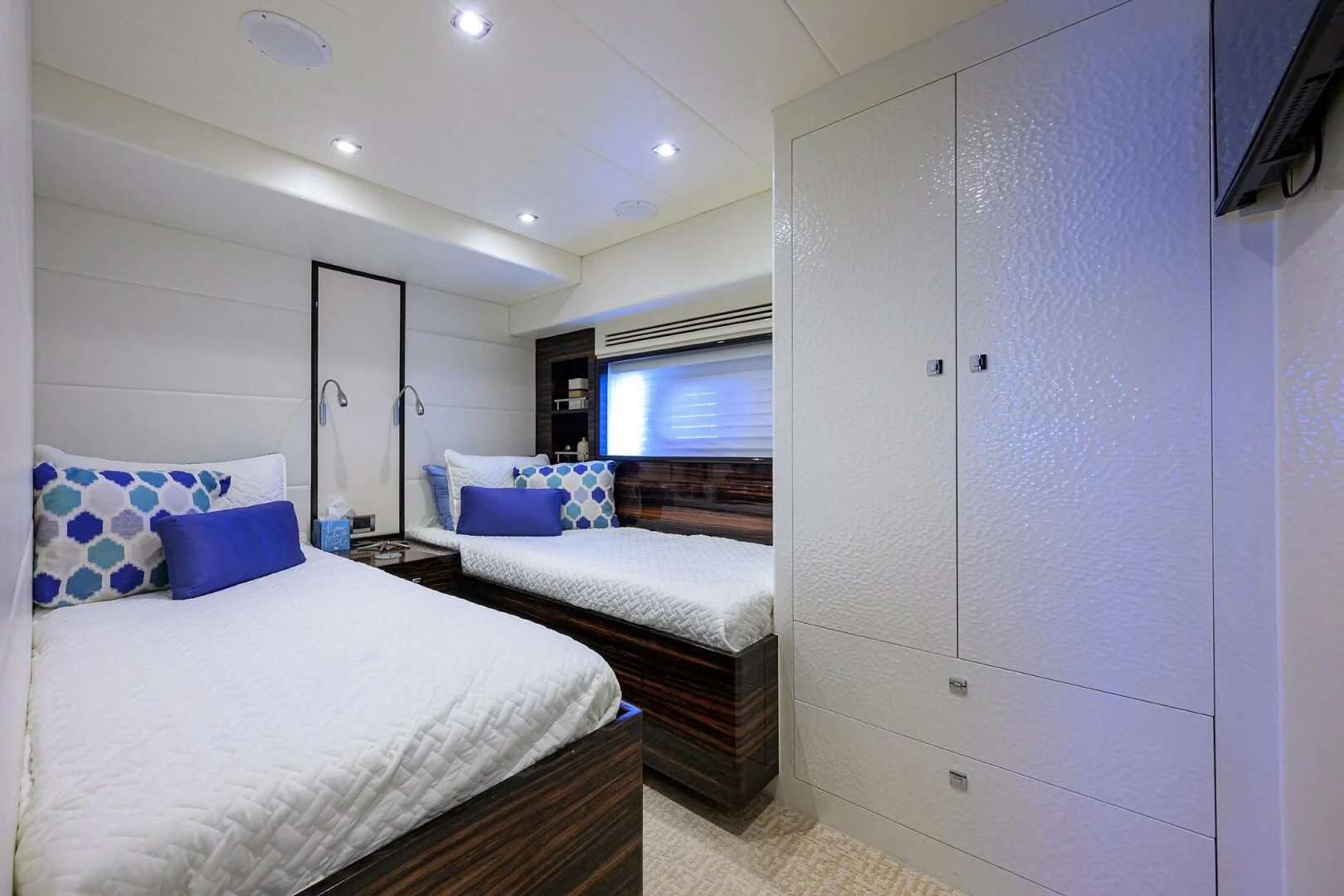 a room with a bed and a closet aboard FUJIMO Yacht for Sale