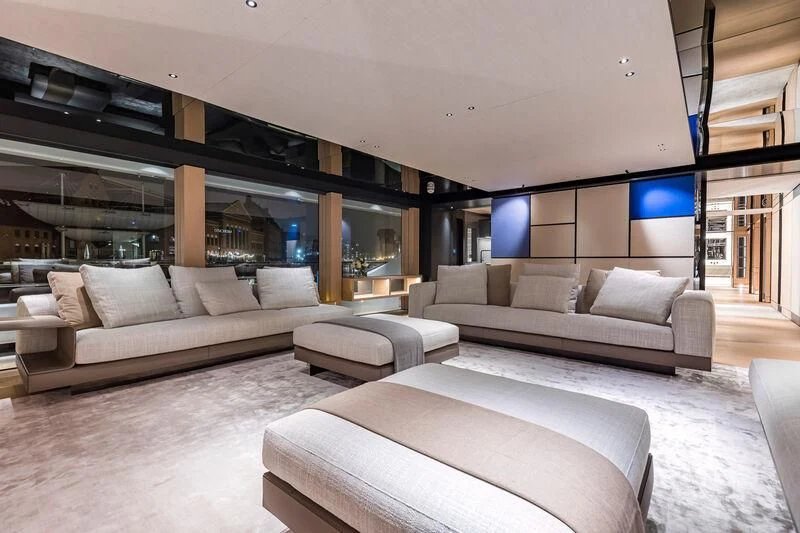 a modern living room with a large open floor plan aboard ACE Yacht for Sale