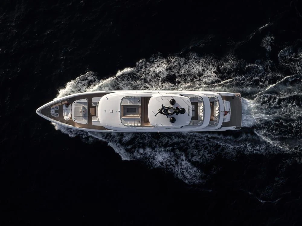 a white car with a logo on it aboard ACE Yacht for Sale