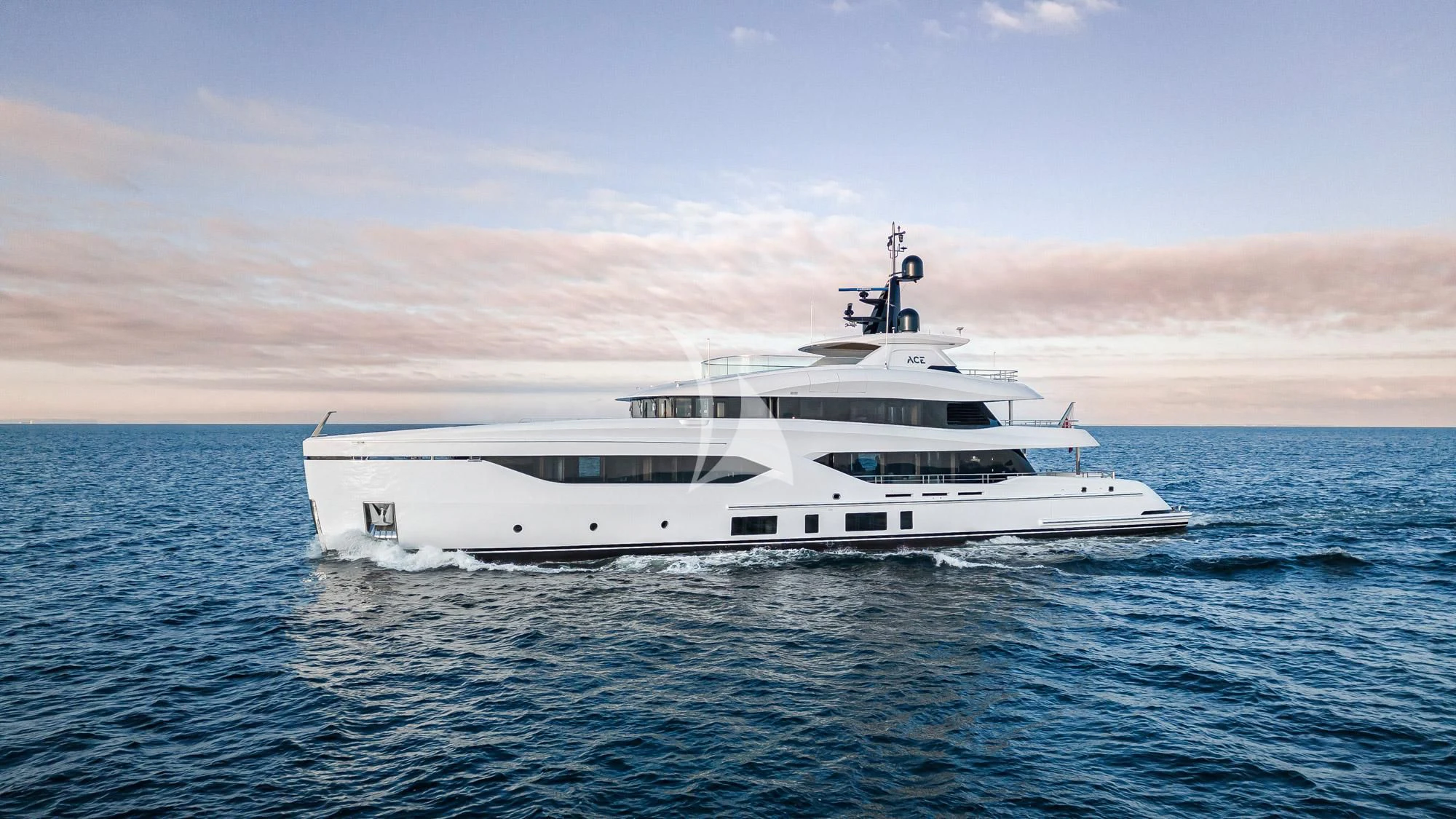 a white yacht in the water aboard ACE Yacht for Sale