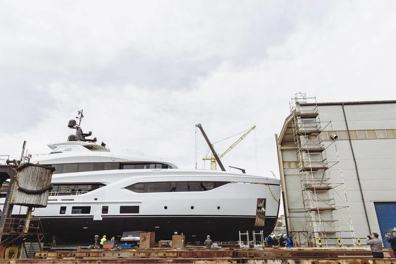 a large white boat with a ladder on top aboard ACE Yacht for Sale