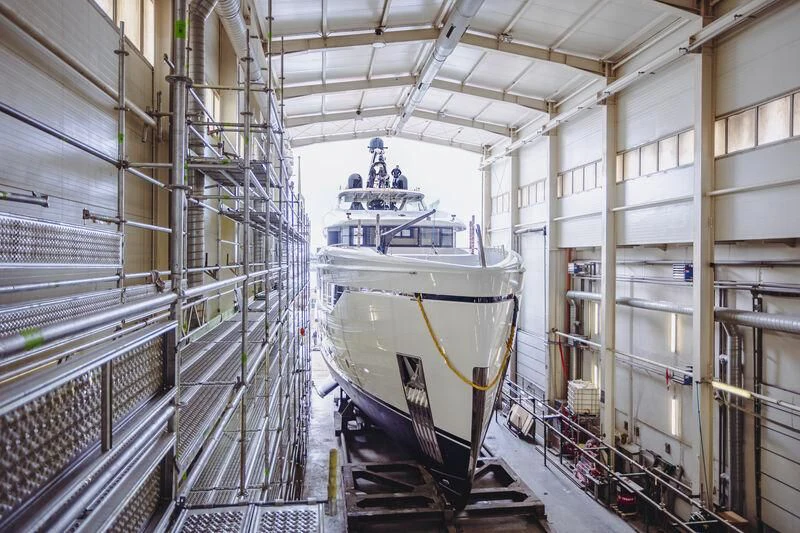 a large ship in a warehouse aboard ACE Yacht for Sale