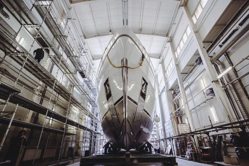 a large clock in a building aboard ACE Yacht for Sale