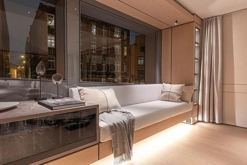 a room with a bed and a desk aboard ACE Yacht for Sale