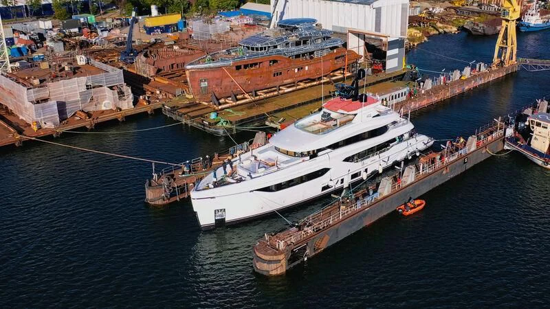 a large ship docked aboard ACE Yacht for Sale