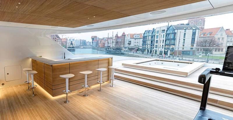 a room with a large window and a view of a city aboard ACE Yacht for Sale