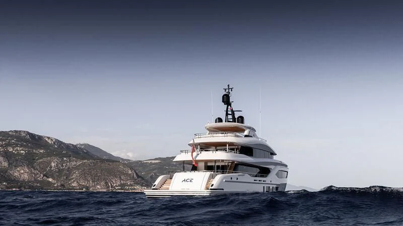 a white boat in the water aboard ACE Yacht for Sale