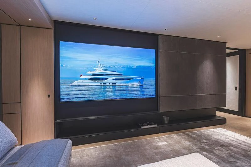 a large television screen aboard ACE Yacht for Sale