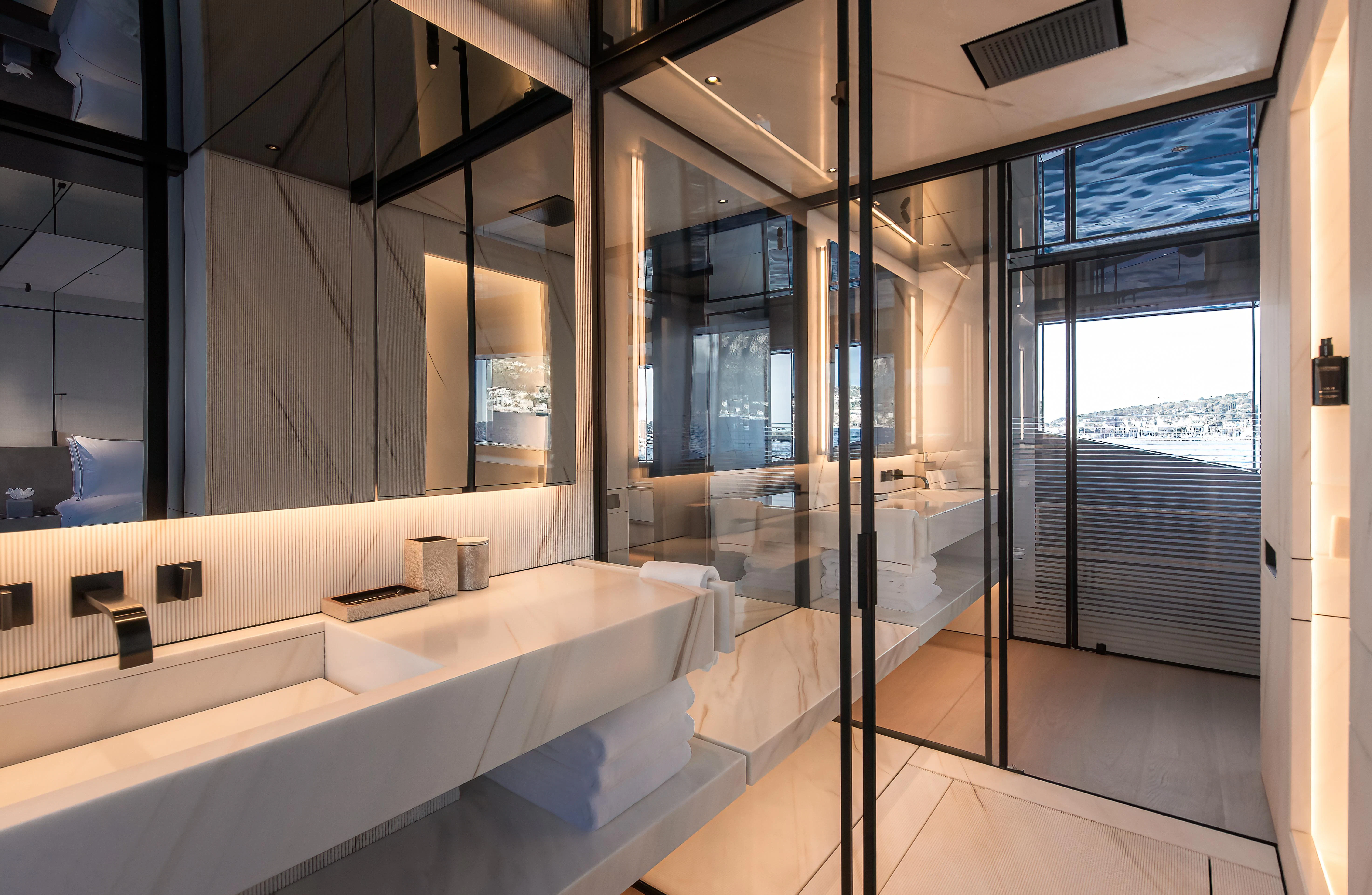 a bathroom with a tub and a shower aboard ACE Yacht for Sale