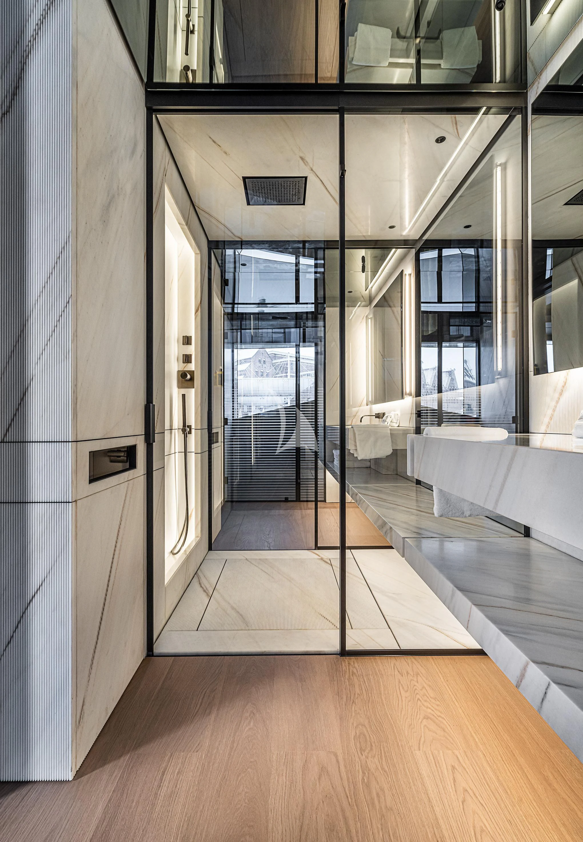a hallway with glass doors aboard ACE Yacht for Sale