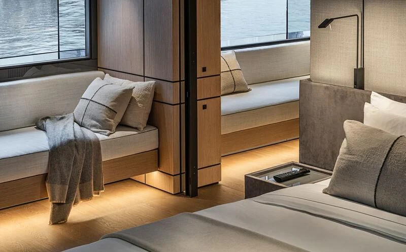 a cat lying on a couch aboard ACE Yacht for Sale