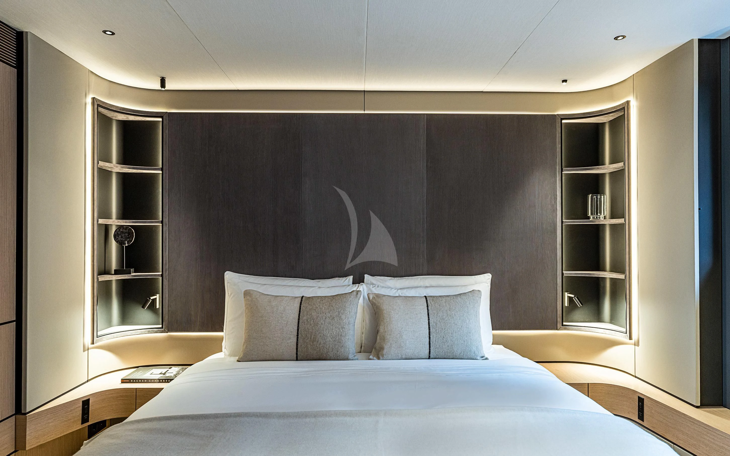 a bed with white sheets aboard ACE Yacht for Sale