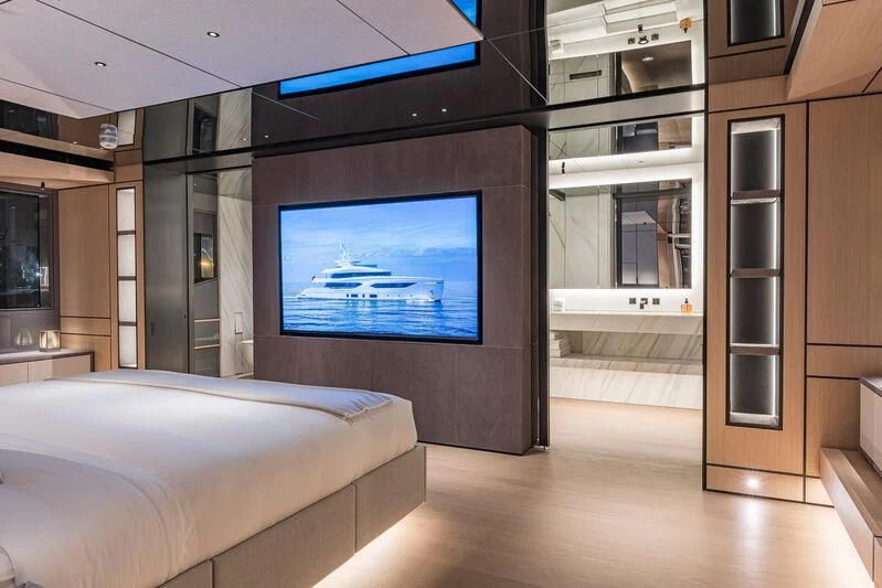 a room with a tv and a bed aboard ACE Yacht for Sale