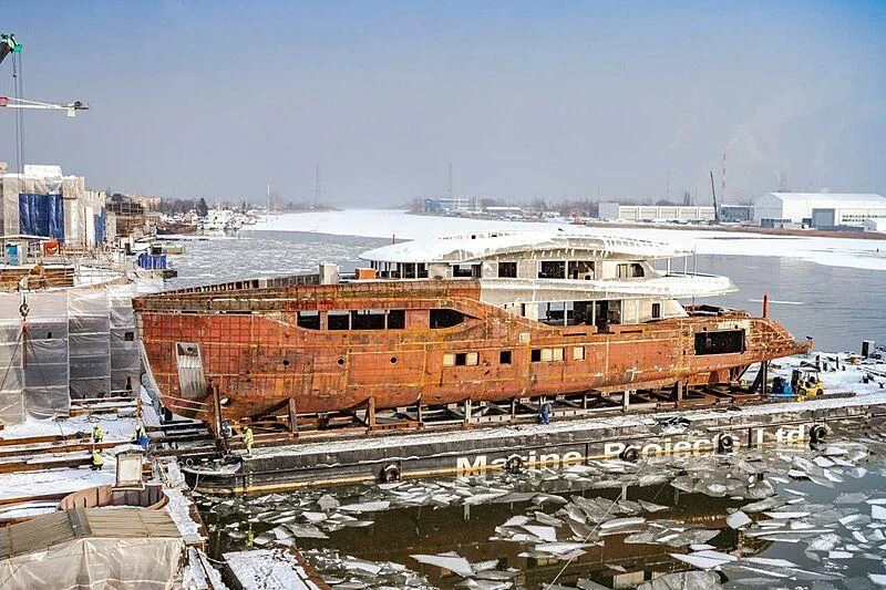 a large orange building with a lot of windows and a lot of snow aboard ACE Yacht for Sale