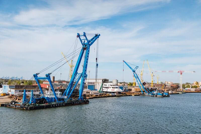 a crane on a barge aboard ACE Yacht for Sale
