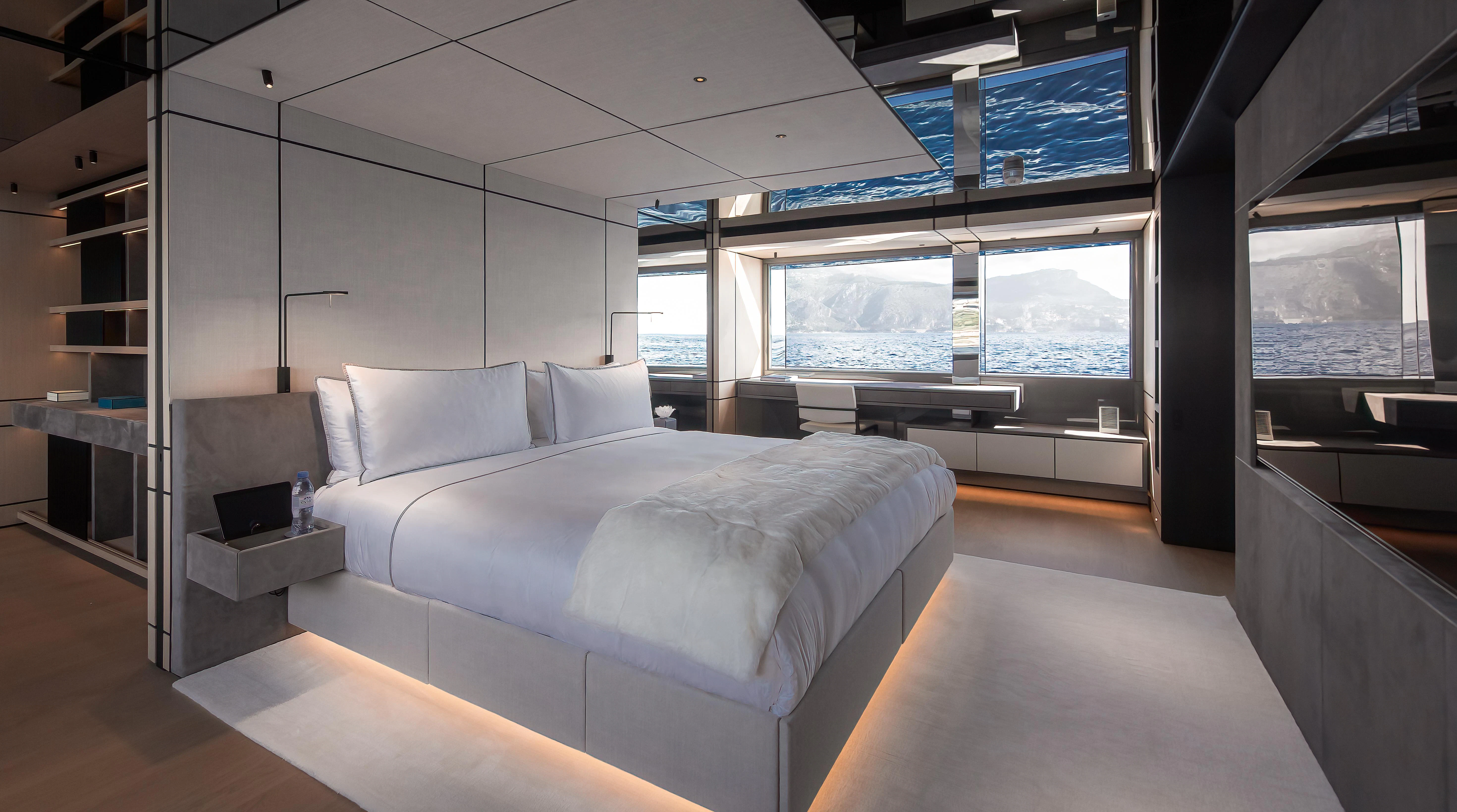 a room with a bed and a tv aboard ACE Yacht for Sale