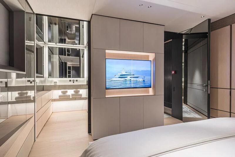 a room with a bed and a tv aboard ACE Yacht for Sale